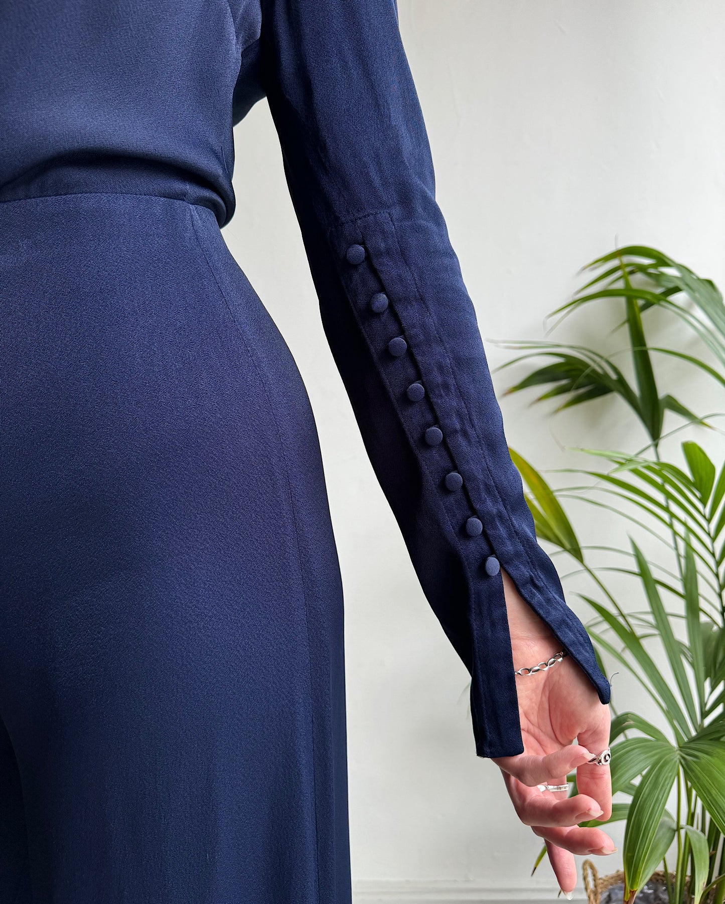 Cuff detail of navy jumpsuit by Les Heroines