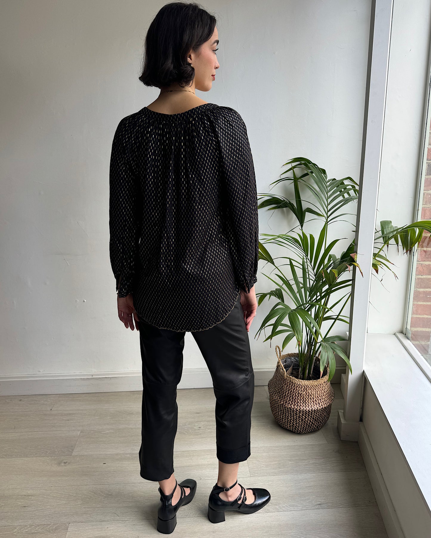 Back view of stunning Velvet by Graham & Spencer black & gold peasant-style top.