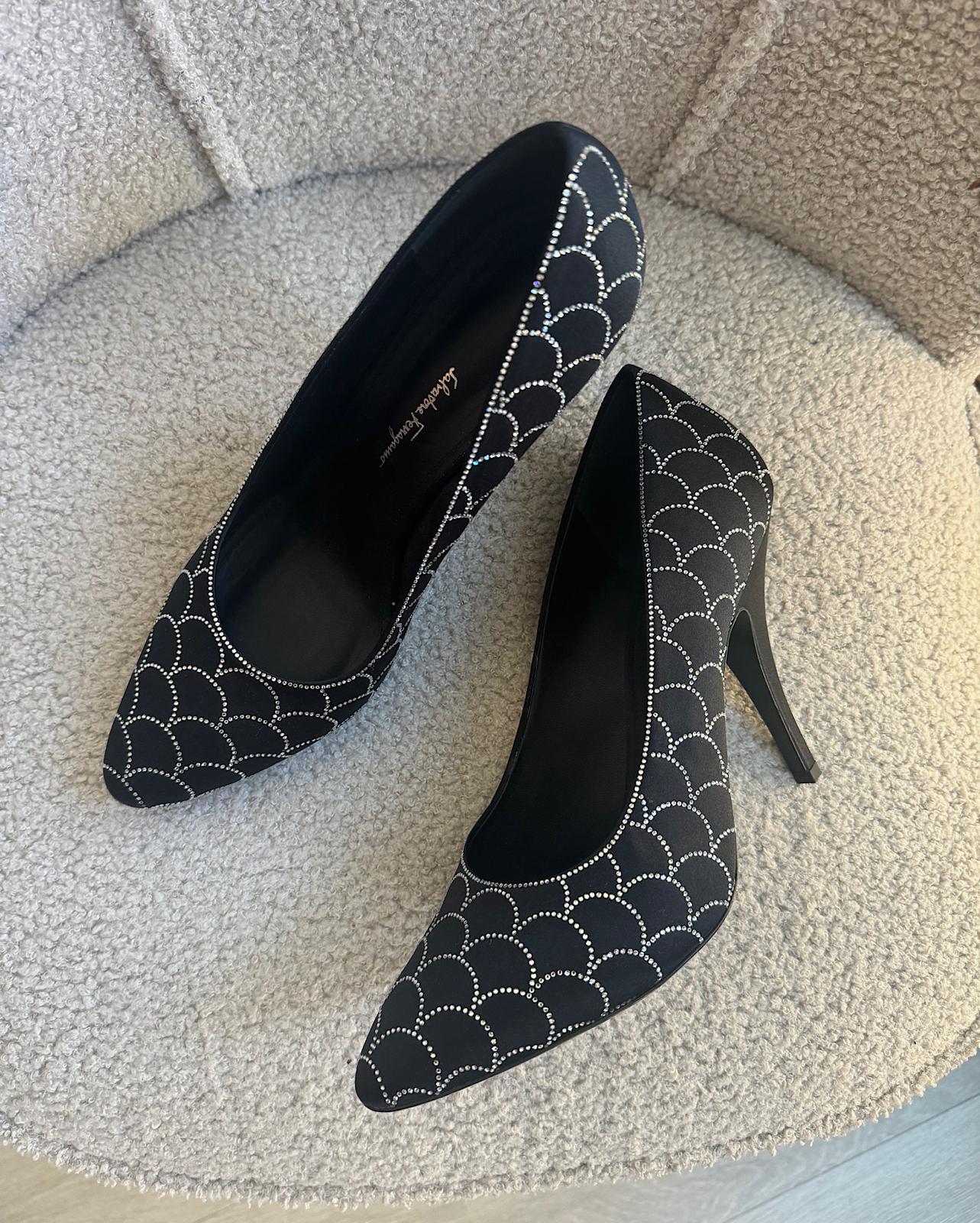 stunning pair of black satin heels by Salvatore Ferragamo. Semi pointed with crystal embellishments.