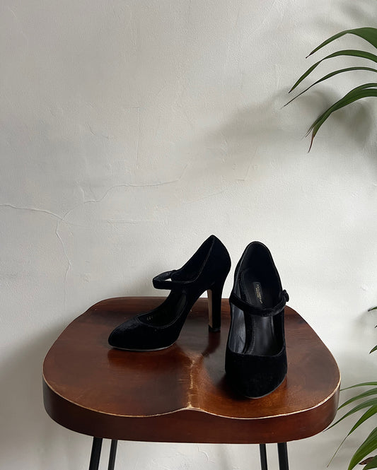 Black Dolce & Gabbana Velvet Heels ~ Size 5 on wooden seat