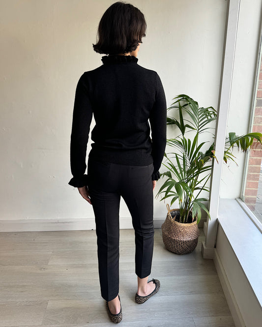 Back view of chic black textured trousers by Orla Kiely.