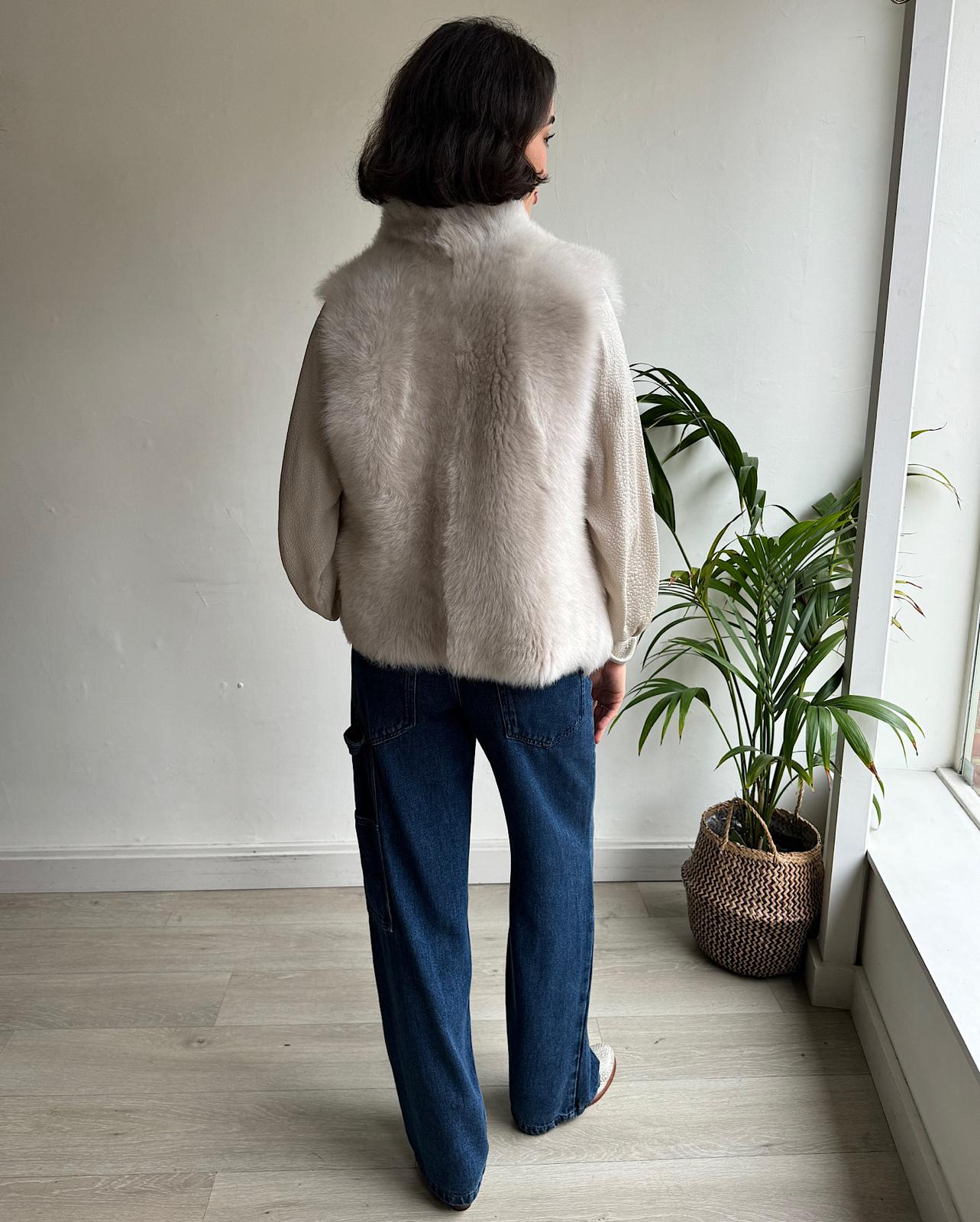 Back view of stylish short toscana sheepskin gilet by Whistles