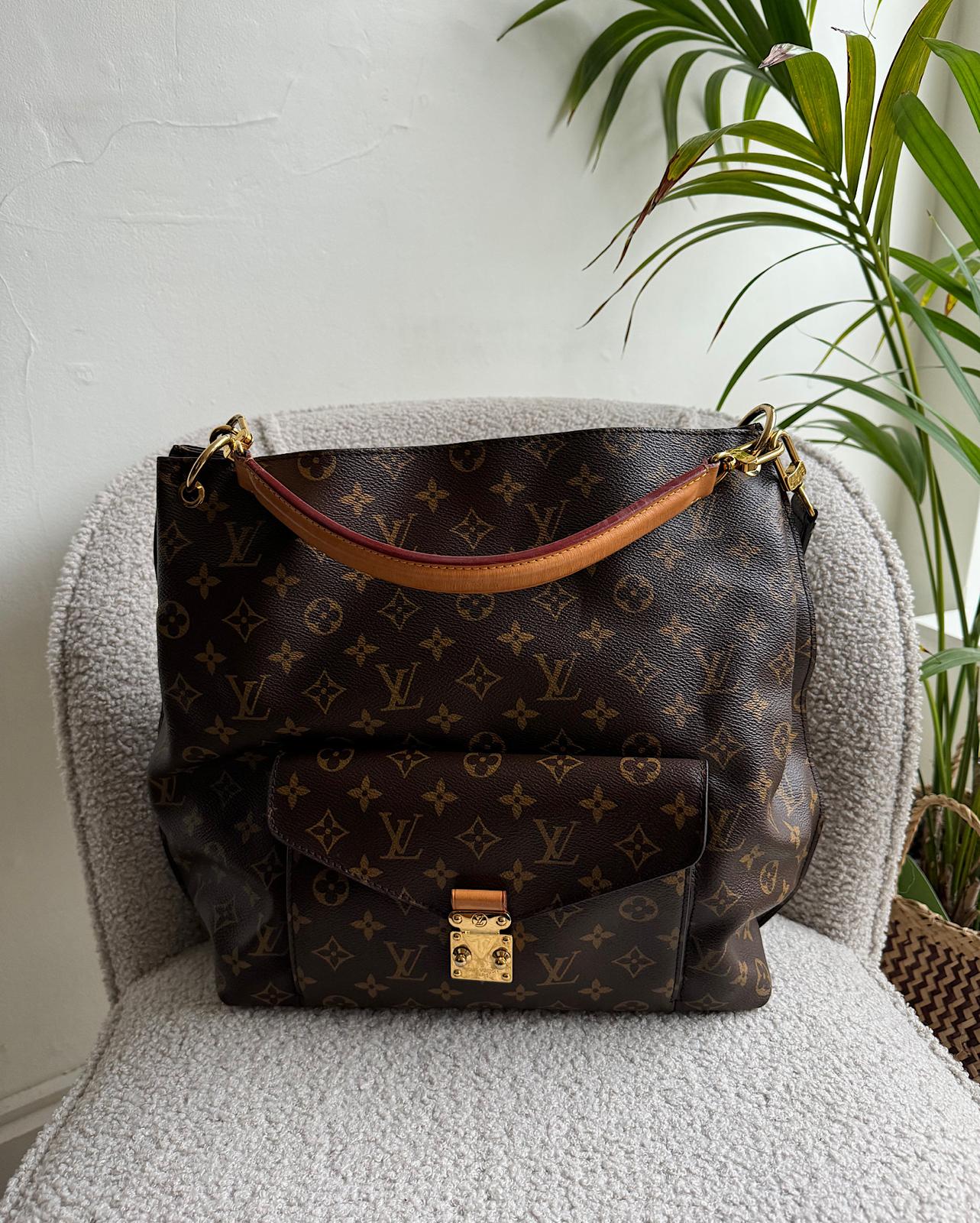 Front view of beautiful Methis Hobo tote by Louis Vuitton showcases the iconic LV monogram