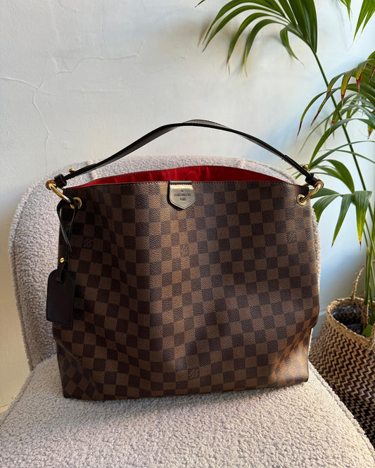 The iconic Louis Vuitton Graceful MM in the signature Damier Ebene canvas