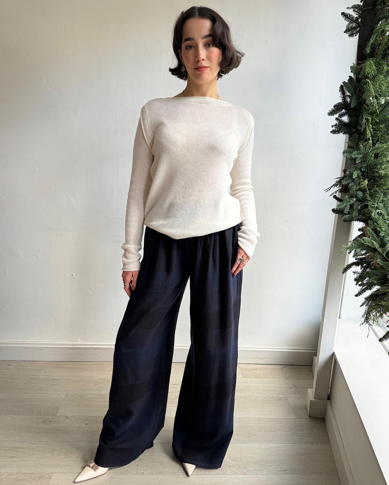 Front view of pair of elegant navy and black large check wool trousers by Temperley London.&nbsp;