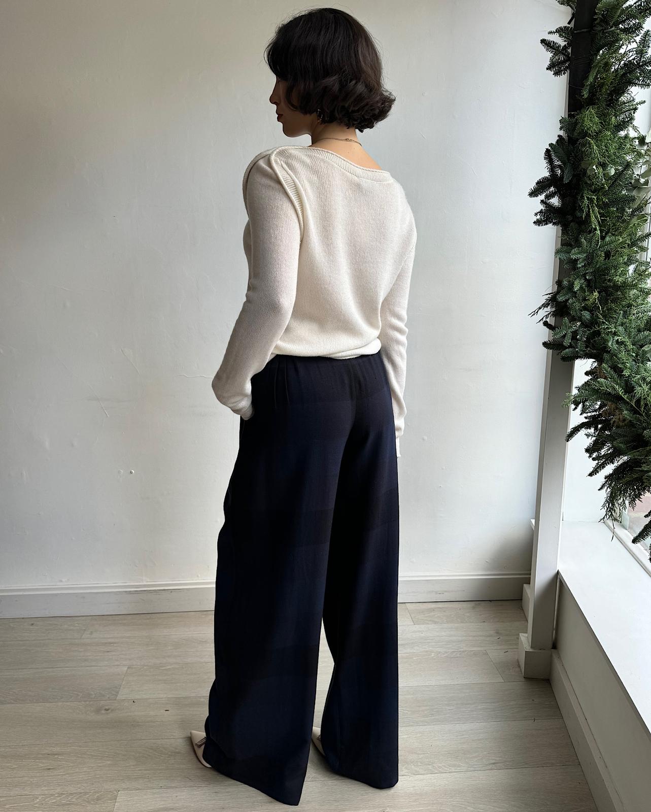 back view of pair of elegant navy and black large check wool trousers by Temperley London.&nbsp;