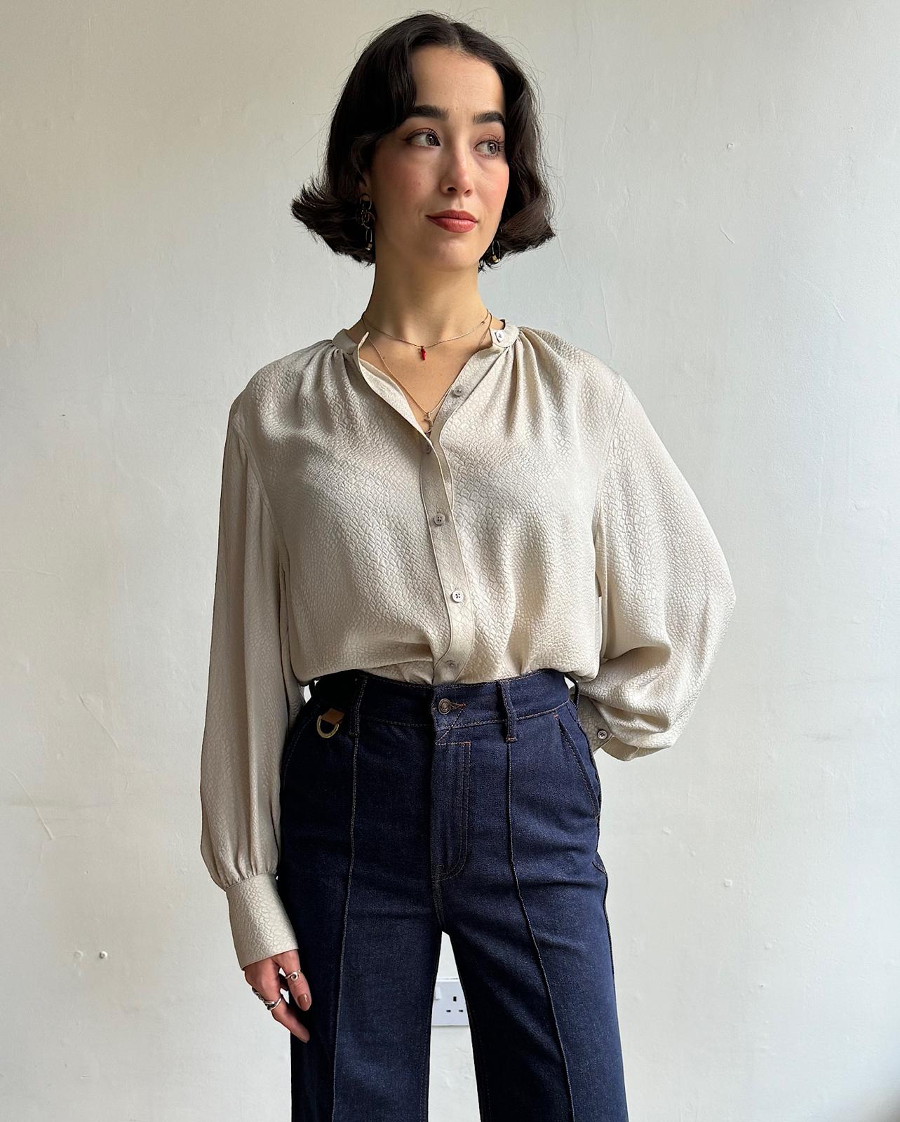 Front view of Stylish textured silk blouse by Equipment Femme styled tucked in