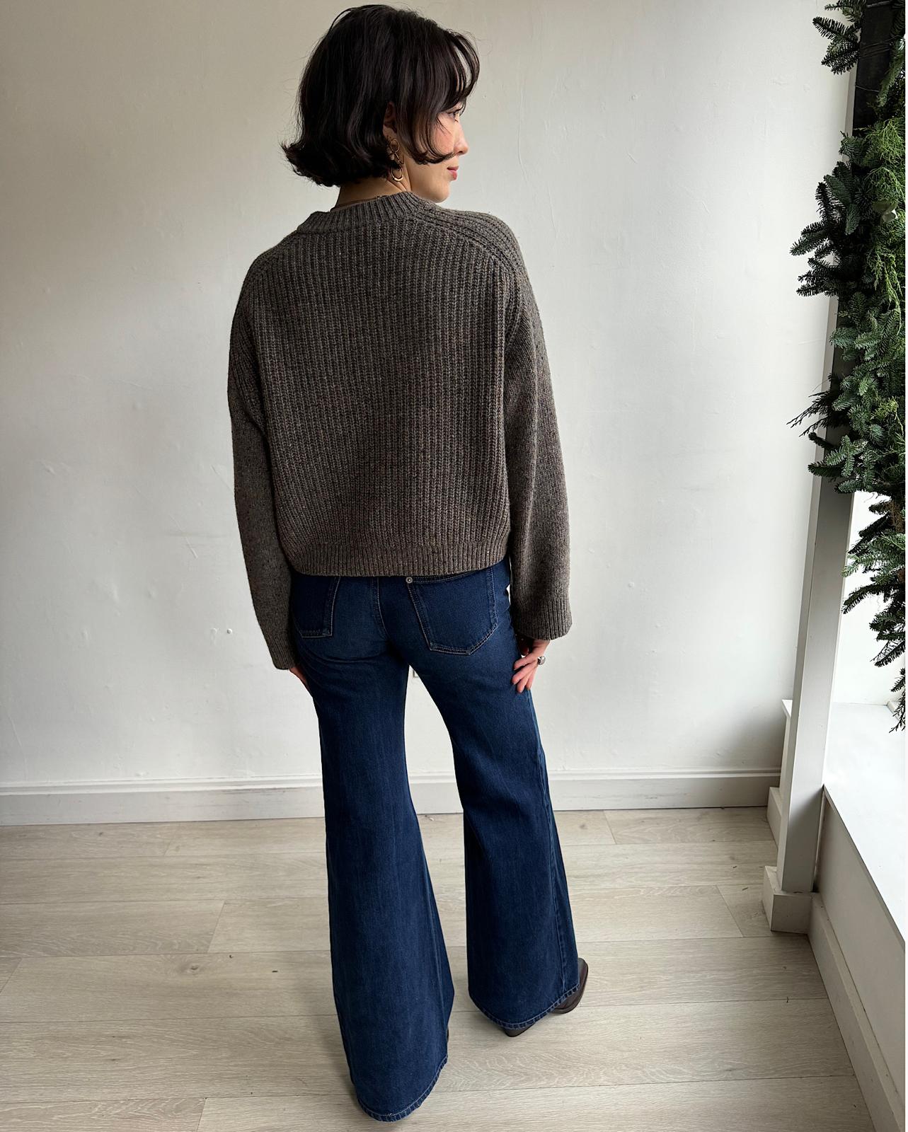 Back view of soft cable-knit 'Delora' sweater by Vanessa Bruno in taupe