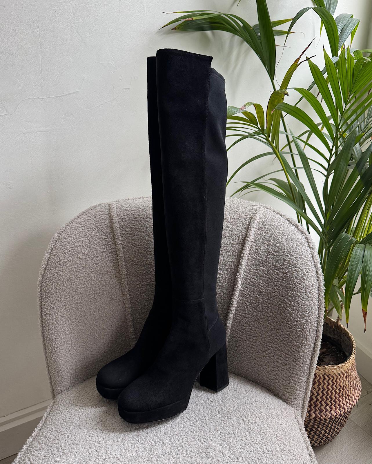 Side view of fashionable pair of black over-the-knee 'Honey Hi' platform boots from Russell &amp; Bromley