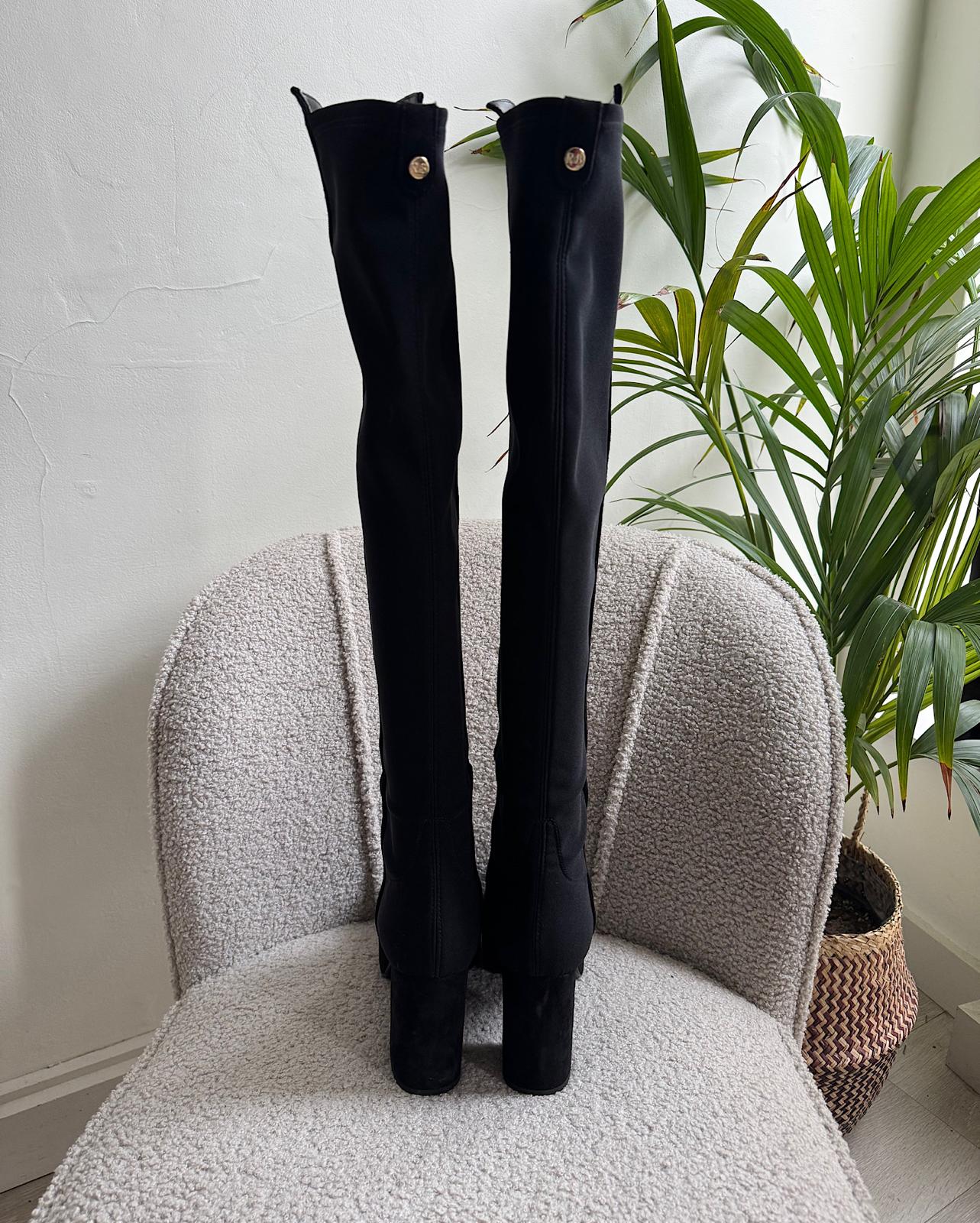 Back view of fashionable pair of black over-the-knee 'Honey Hi' platform boots from Russell &amp; Bromley