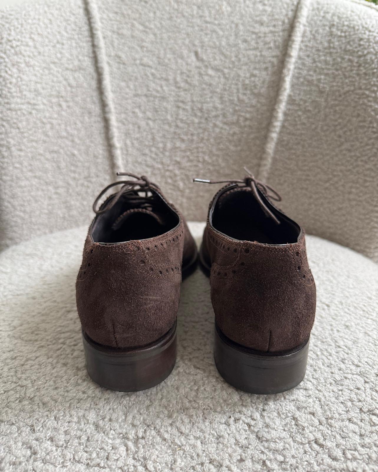 Back view of stylish pair of brown suede wingtip Oxford shoes from Moloh