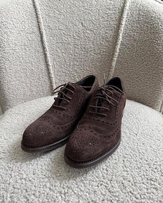 Front view of stylish pair of brown suede wingtip Oxford shoes from Moloh