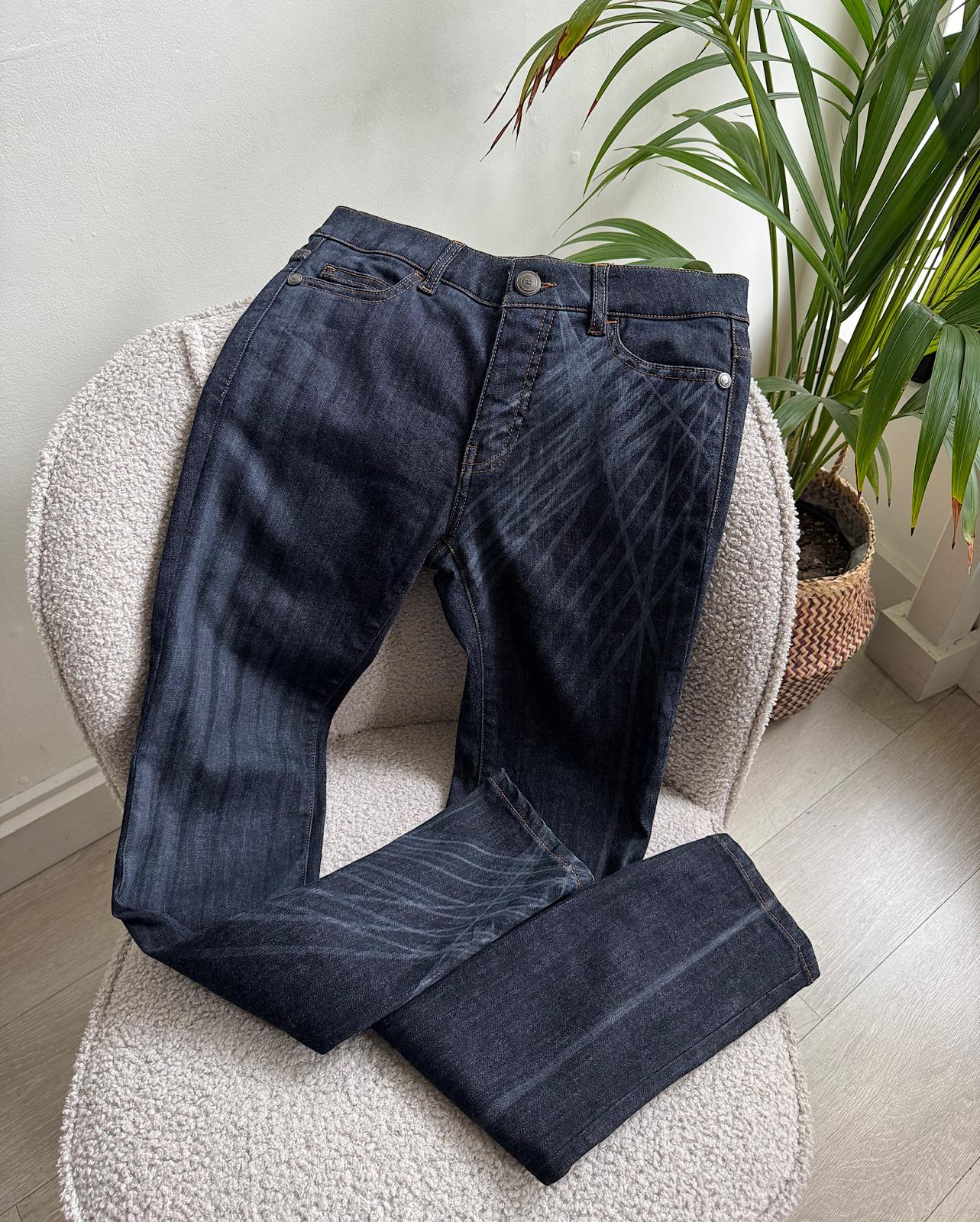 A gorgeous pair of dark wash denim skinny jeans from Chanel