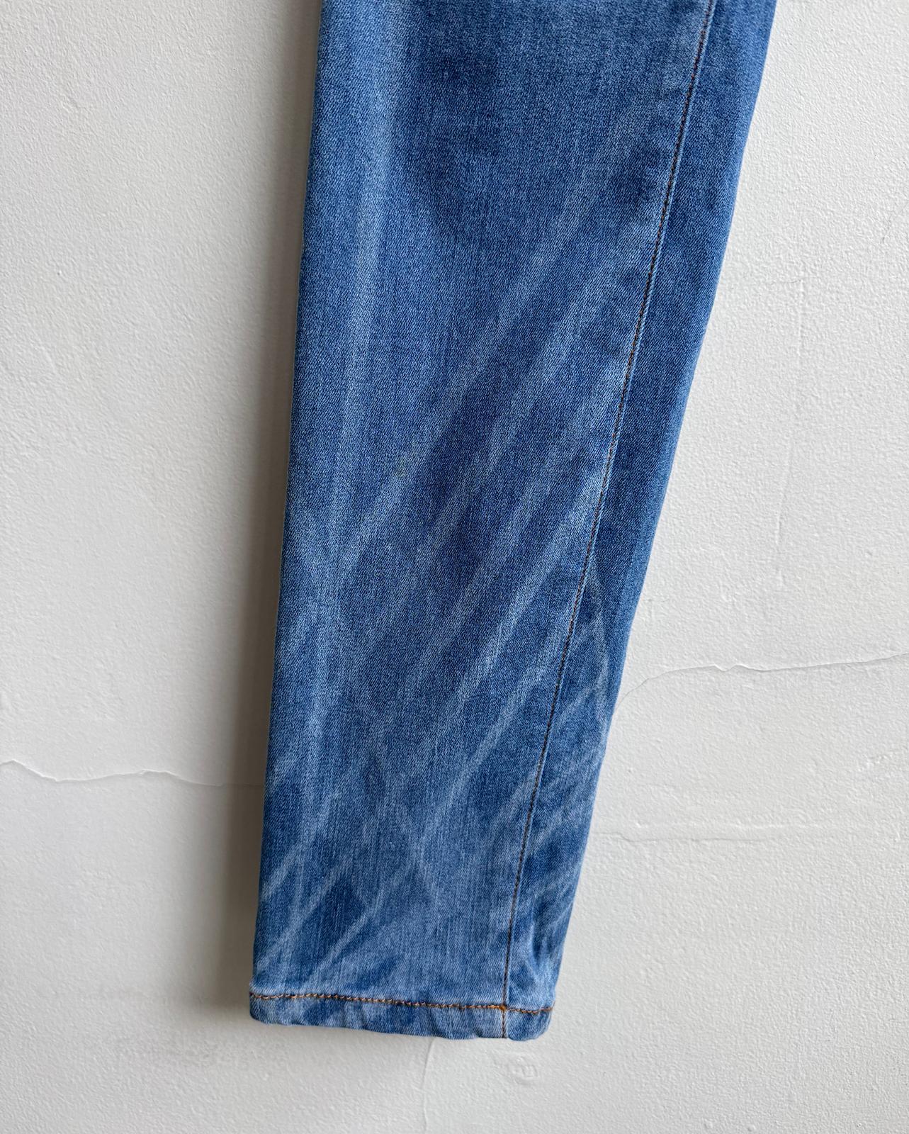 Leg detail of gorgeous pair of blue-wash denim skinny jeans from Chanel