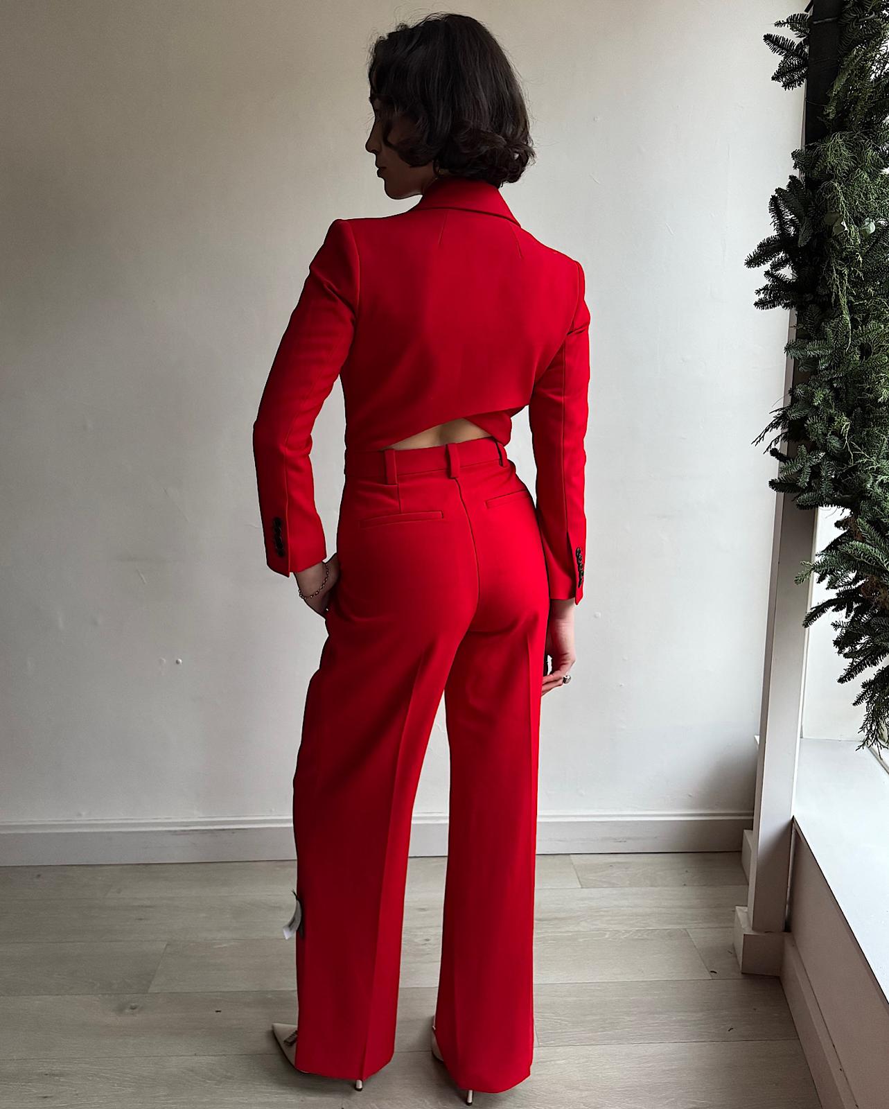 Back view of  stylish red 'Tatum' jumpsuit by A.L.C featuring padded shoulders, a high waist and a cut-out detail at the back. 