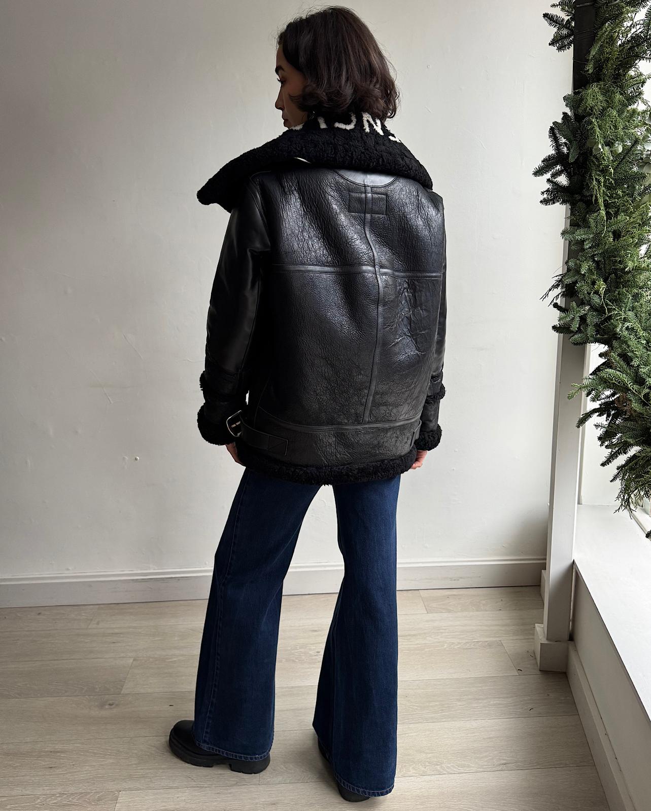 Back view of exquisite black shearling and leather "Le Bombardier" jacket by Balenciaga