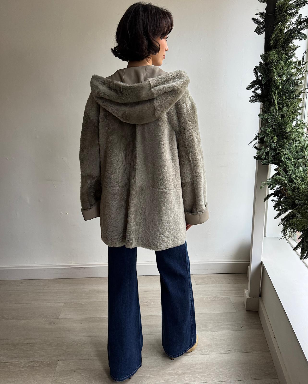 Back view of exquisite reversible short shearling "Cosser" coat by Joseph with shearling side showing