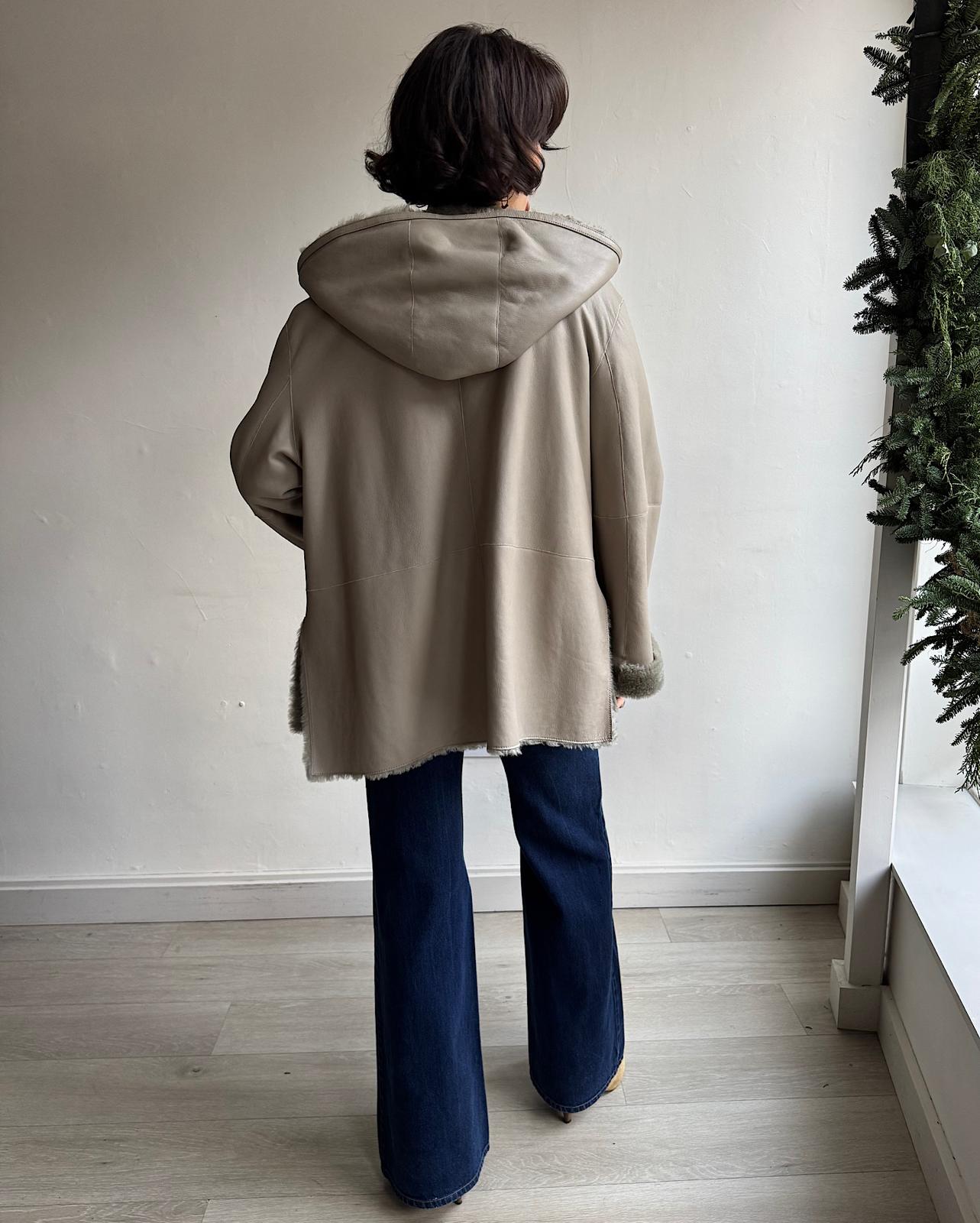 Back view of exquisite reversible short shearling "Cosser" coat by Joseph. Leather side showing.