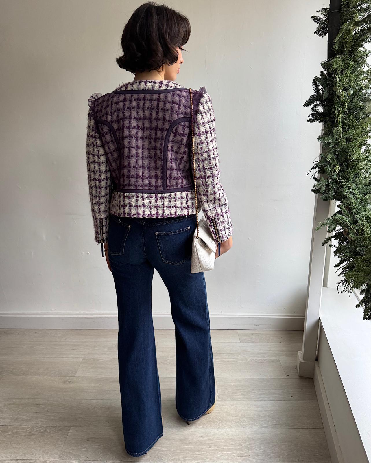 Back view of stylish short tweed jacket by Luella is fully lined in silk and features beautiful tulle details.