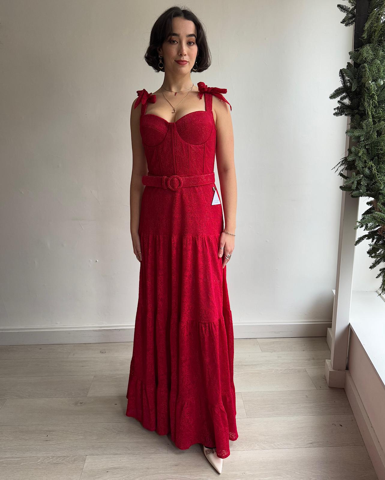 Front view of  beautiful red lace hand-finished 'Miranda' maxi dress by Nadine Merabi features bow-detailed straps, a sweetheart neckline, and a three-tiered skirt. 