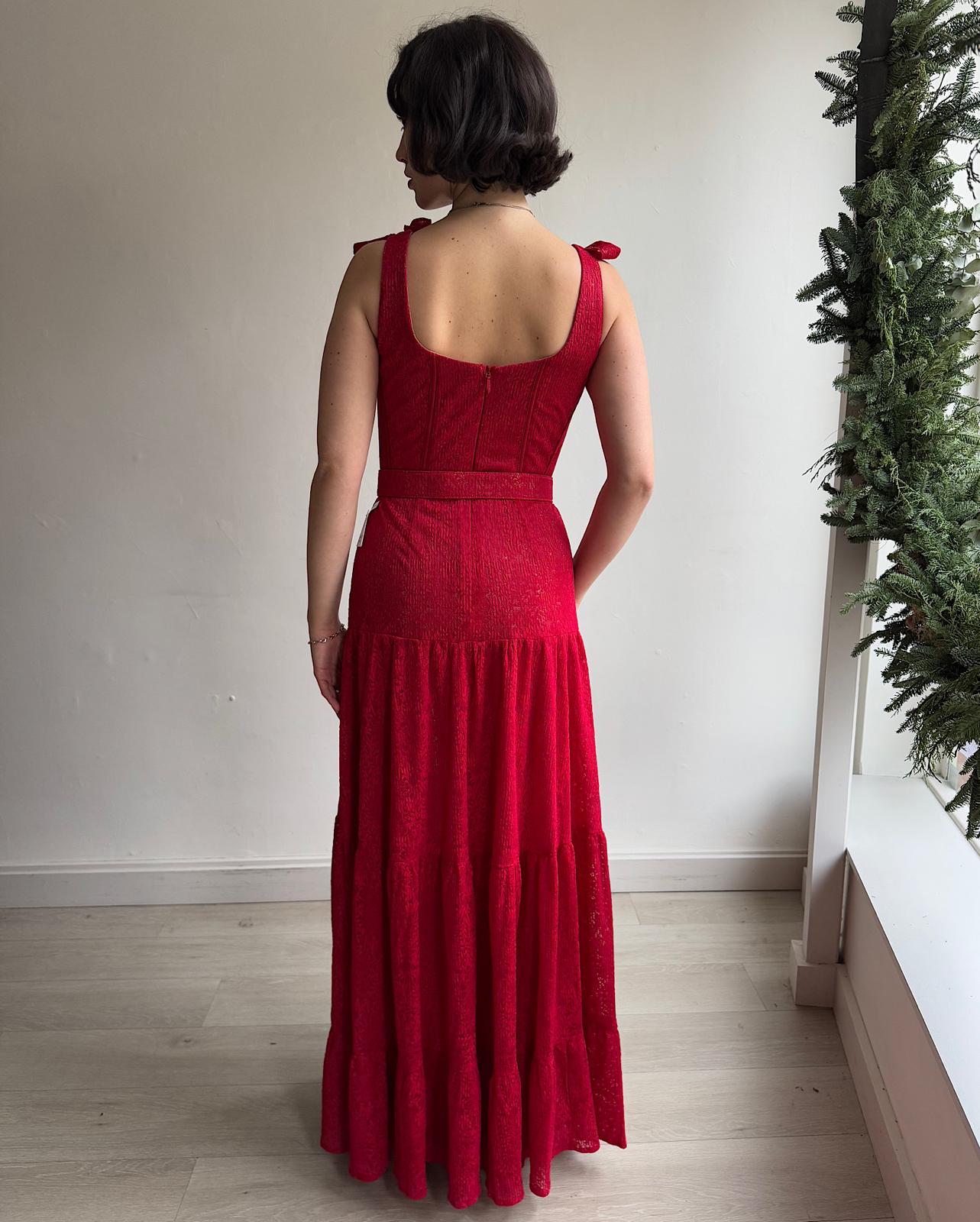 Back view of  beautiful red lace hand-finished 'Miranda' maxi dress by Nadine Merabi features bow-detailed straps, a sweetheart neckline, and a three-tiered skirt. 